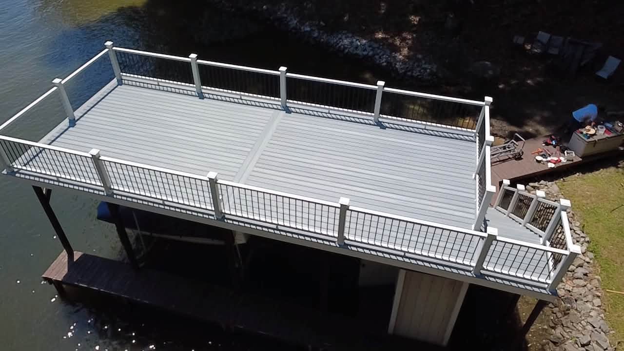 Evening view of a dock railing over Lake Gaston